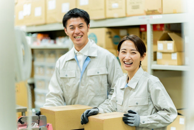factory workers packing boxes